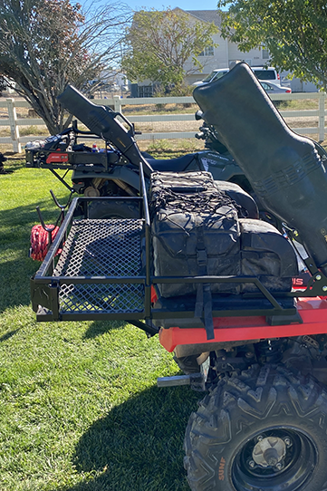 ATV rear rack fully loaded outdoors